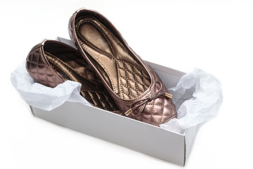 ladies shoes and box on a white background © praisaeng