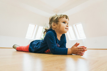 Beautiful child in an empty room