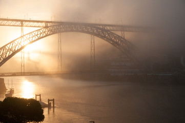 Bridge in dawn mist
