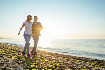 young loving couple having fun on beach