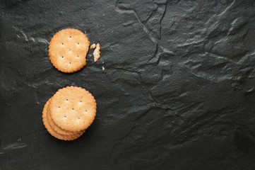 cracker stacked on black granite