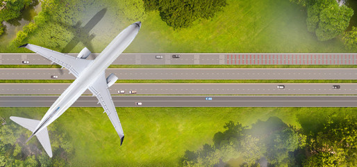 Top view of airplane flying over the roads