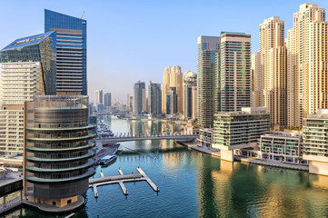 Fototapeta na wymiar View of Dubai Marina skyscrapers in Dubai, UAE. Dubai Marina is a canal city carved along a two mile (3 km) stretch of Persian Gulf shoreline and is the heart of what has become known as 
