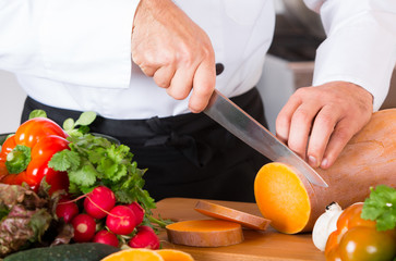 Chef chopping vegetables