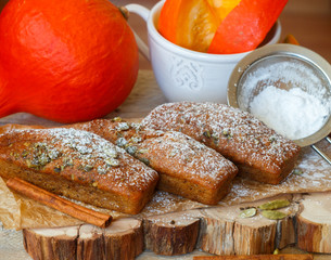 Homemade pumpkin financier cake with cinnamon and cardamom. Autumn spiced cakes. A rustic style....