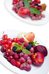 plates with fruits and berries