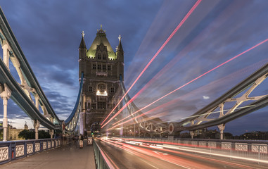 Tower Bridge, London, with traffic light trails passing over the bridge, in the evening
