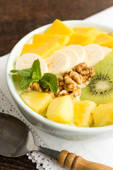 Vegan Smoothie Bowl with Tropical Fruits including Mango, Kiwi and Pineapple