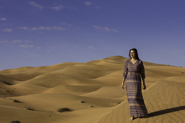 Fototapeta na wymiar Model Anna in the Rub'al Khali Desert aka The Empty Quarter