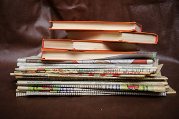 kerosene lamp and books on a brown background