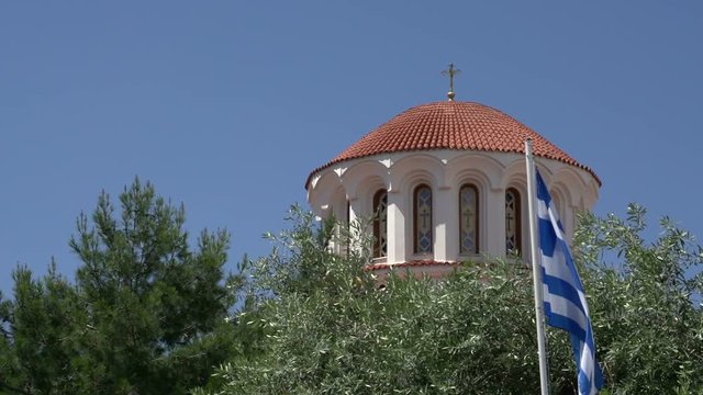 Potos church with greek flag in Thassos Greece