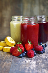 Three portions of different smoothies.