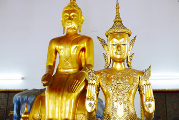 Buddha gold statue and thai art architecture in Wat Phra Chetupon Vimolmangklararm (Wat Pho) temple in Thailand.