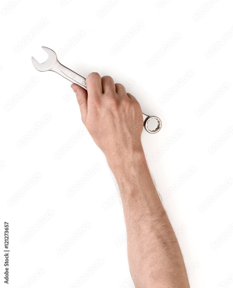 Wall mural close up view of a man's hand holding combination wrench isolated on white background