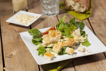 ceasar salad on rustic wood