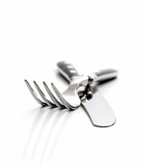 Cutlery, fork with knife isolated on white