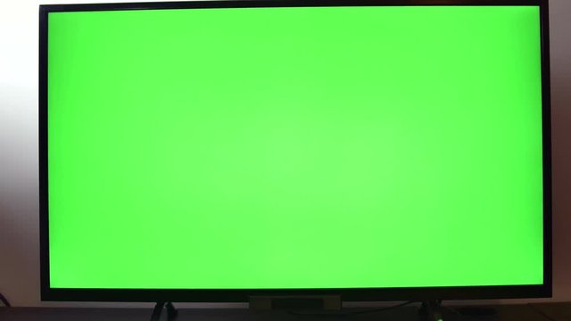 Pan Over A TV Set With Green Screen
