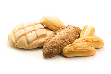 Group of different types of breads on a white background