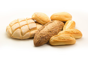 Group of different types of breads on a white background