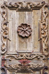 Detail of old wooden door Catholic monastery