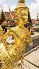 Golden angel statue of the Emerald Buddha temple(Wat phra kaew) and Royal Grand Palace ,Bangkok,Thailand.