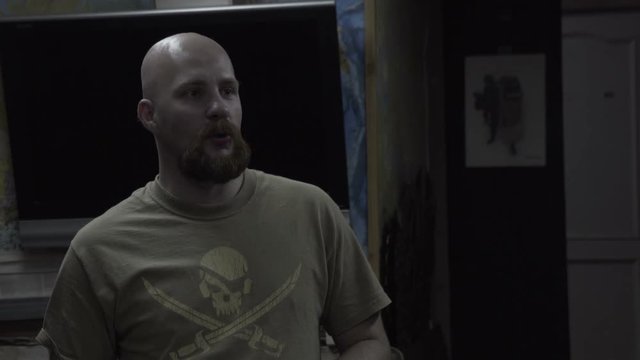 Bald man in a T-shirt with a skull says. The bearded guy with a pirate on the chest says.