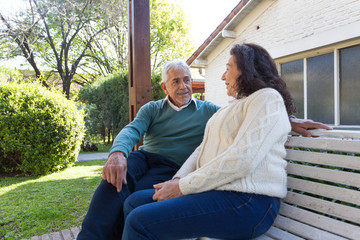 Fototapeta premium Elder people talking on the park bench