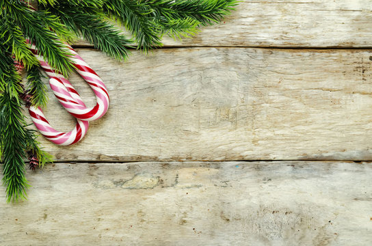 wood background with Christmas tree, candy