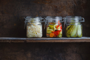 Fototapeta na wymiar Pickled vegetables in glass jars