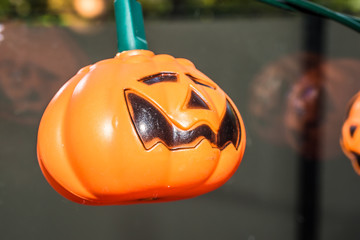 Hallowen holiday lights shaped like Jack O'Lantern pumpkin