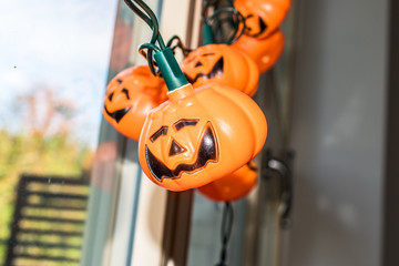 Hallowen holiday lights shaped like Jack O'Lantern pumpkin