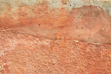 Abstract old terracotta plastered red wall texture background