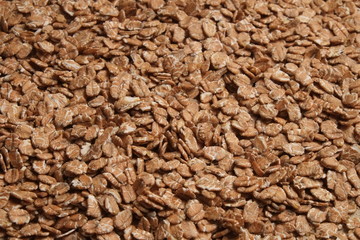 Overview photograph of oat flakes, rolled grains. Healthy lifestyles and nutrition