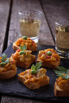 Canape with eggplant caviar and glasses of wine