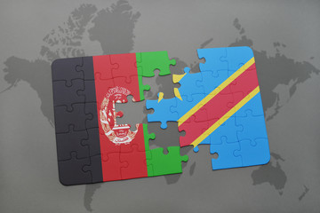puzzle with the national flag of afghanistan and democratic republic of the congo on a world map background.
