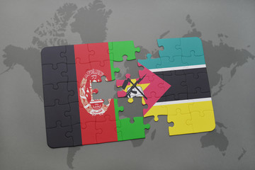 puzzle with the national flag of afghanistan and mozambique on a world map background.