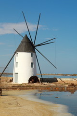 Fototapeta na wymiar Traditional windmill in the salt marshes of San Pedro del Pinatar, in the region of Murcia, Spain