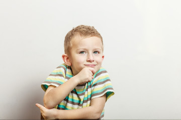 Naklejka premium Little boy have fun with funny gestures