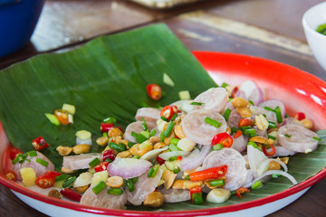 spicy pork on banana leaf