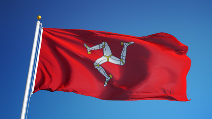 Isle of Man flag waving against clean blue sky, close up, isolated with clipping path mask alpha...