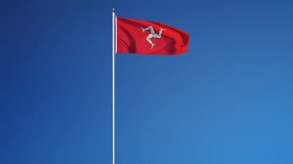 Isle of Man flag waving against clean blue sky, long shot, isolated with clipping path mask alpha channel transparency