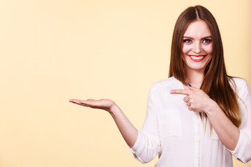 Woman holds empty hand copy space for product