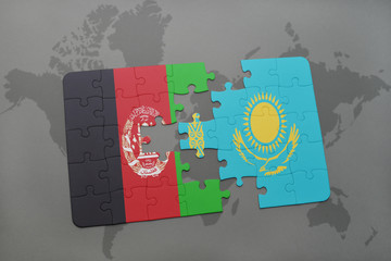 puzzle with the national flag of afghanistan and kazakhstan on a world map background.