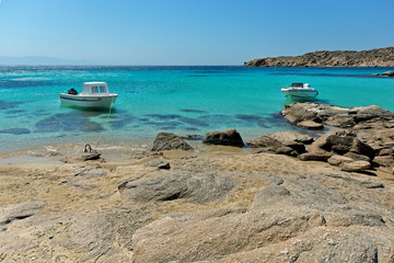 Small boat in Paranga Beach on the island of Mykonos, Cyclades, Greece