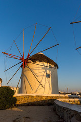 Sunset over White windmills on the island of Mykonos, Cyclades, Greece