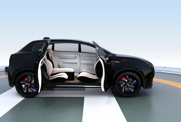 Naklejka premium Black electric SUV parking on the helipad. The doors opened and front seats rotated to backward. Concept for autonomous vehicle. 3D rendering image.