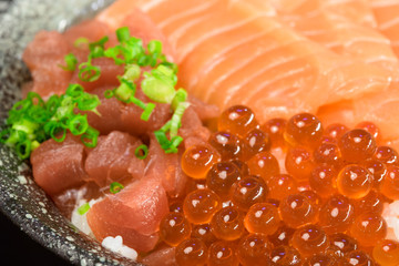 Raw chirashi salmon don with ikura egg