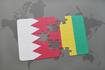 puzzle with the national flag of bahrain and guinea on a world map background.