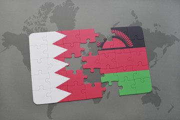puzzle with the national flag of bahrain and malawi on a world map background.