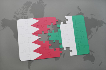 puzzle with the national flag of bahrain and nigeria on a world map background.